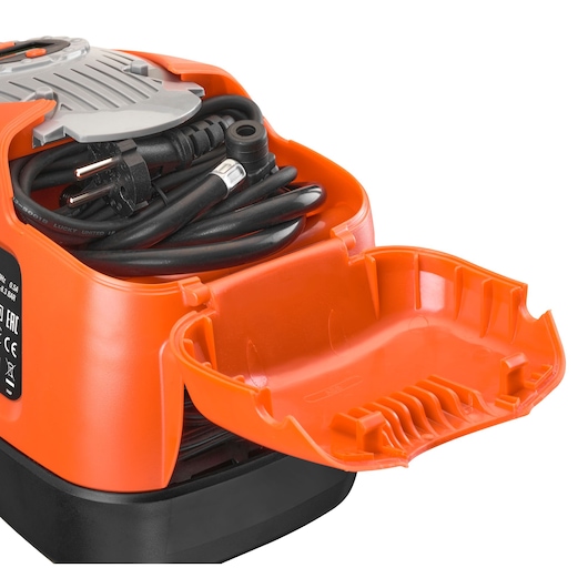 BLACKDECKER ASI300 air compressor close-up, showing orange storage compartment with coiled black power cord, white background.