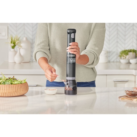 Photo of BLACKDECKER BCKM101SPFF electric grinder in use on a kitchen counter.