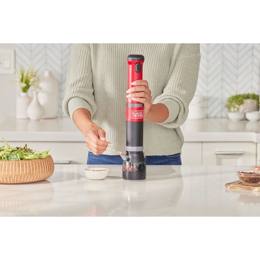 Photo of BLACKDECKER BCKM101SPFF electric spice grinder in use on a kitchen counter.
