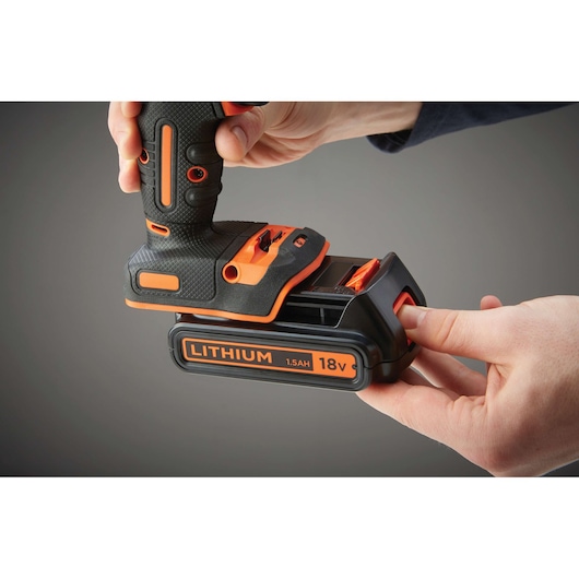 Photo of BLACKDECKER BDCHD18 cordless drill with 18V lithium battery being inserted.