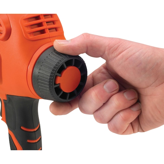 Photo of BLACKDECKER BDPS200 sander close-up showing the hand adjusting the black and orange knob.