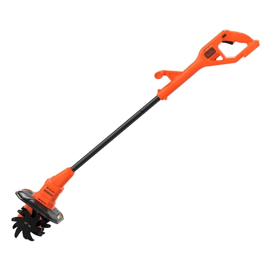 A BLACK+DECKER cordless garden tiller with an orange and black design, featuring a long handle and rotating blades at the base for soil cultivation.