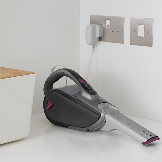 BLACKDECKER FEJ520JFS handheld vacuum cleaner, gray and purple, side angle, placed on white countertop