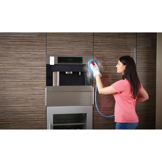 BLACKDECKER FSMH13101SM steam cleaning glove used to clean kitchen appliance surface.