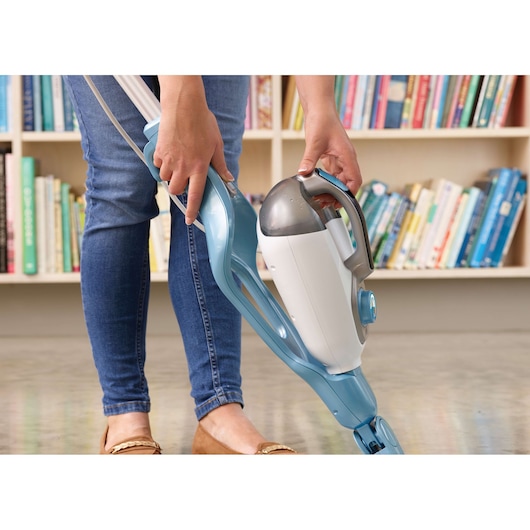 Photo of BLACKDECKER FSMH13151SM steam mop with detachable handheld unit, shown in use on a hard floor.