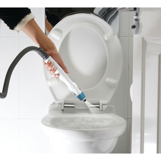 BLACKDECKER FSMH13151SM steam cleaner cleaning toilet bowl in bathroom close-up.