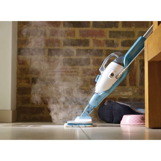 BLACKDECKER FSMH1321 steam mop cleaning tile floor, side angle, blue and white body, visible steam.