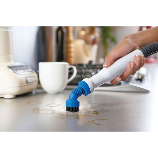 BLACKDECKER FSMH1321 steam cleaner brush cleaning stained kitchen countertop.