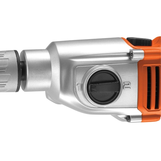 Close-up view of the front part of a BLACK+DECKER power drill, showing a rotary switch with settings labeled 1 and 2 on a silver and orange casing.