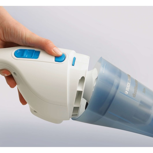 Hand removing dust container from BLACKDECKER NW3620N handheld vacuum, close-up, white and blue design.
