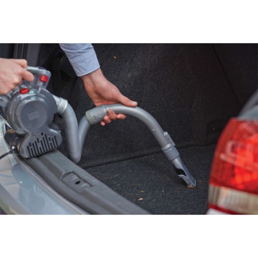 BLACK+DECKER PD1200AV handheld vacuum cleaning car trunk carpet with flexible hose.